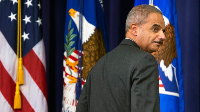 PHOTO: Attorney General Eric Holder glances back at invited guests while leaving after speaking during the Office of Inspector Generals annual awards ceremony, May 29, 2013, at the Justice Department in Washington.