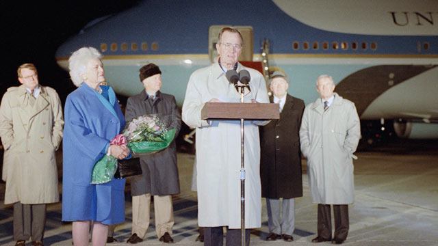 PHOTO: U.S. President George H. Bush, accompanied by first lady Barbara, makes farewell remarks before departing Andrews Air Force Base, Md., Monday, Dec. 30, 1991 for a trip to Australia and Asia.