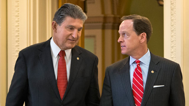 PHOTO: Sen. Joe Manchin, D-W.Va., left, and Sen. Patrick Toomey, R-Pa. arrive for a news conference on Capitol Hill in Washington, April 10, 2013, to announce that they have reached a bipartisan deal on expanding background checks to more gun buyers.