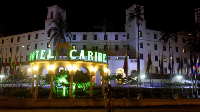 PHOTO: People walk past Hotel El Caribe in Cartagena, Colombia, April 19, 2012.