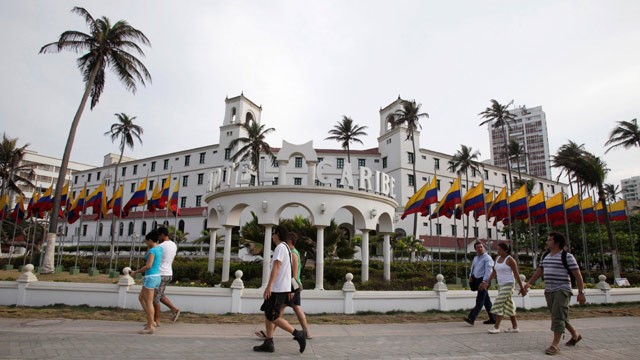 PHOTO: People walk past Hotel El Caribe in Cartagena, Colombia, Saturday April 14, 2012.