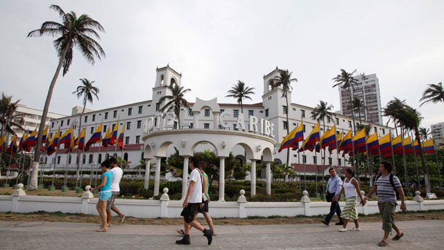 PHOTO: People walk past Hotel El Caribe in Cartagena, Colombia, Saturday April 14, 2012.