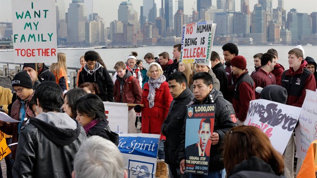 PHOTO: With the New York skyline behind, a group of immigrant rights advocates gather near Ellis Island Wednesday, Feb. 13, 2013, in Liberty State Park, Jersey City, N.J.