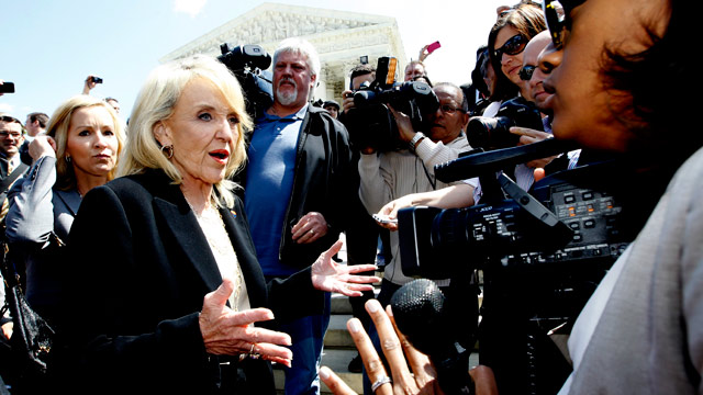 PHOTO: Arizona Gov. Jan Brewer speaks to reporters outside the Supreme Court in Washington, Wednesday, April 25, 2012, after the courts hearing on Arizonas "show me your papers" immigration law.
