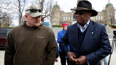 PHOTO: Former Godfather's Pizza CEO Herman Cain talks with Samuel "Joe the Plumber" Wurzelbacher, left, before speaking at a tea party rally in this  April 16, 2011 file photo at the Statehouse in Des Moines, Iowa.