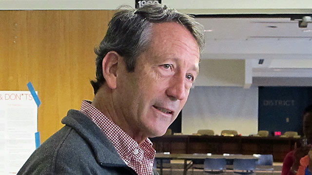 PHOTO: Former South Carolina Gov. Mark Sanford speaks with reporters, March 19, 2013, at a polling place in Charleston, S.C.