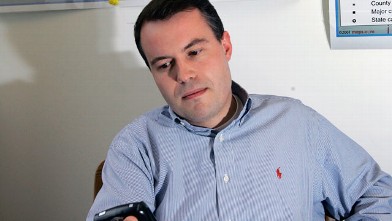 PHOTO: Matt Rhoades, checks his PDA at the Romney 2008 campaign office in Boston in this April 27, 2007 file photo.