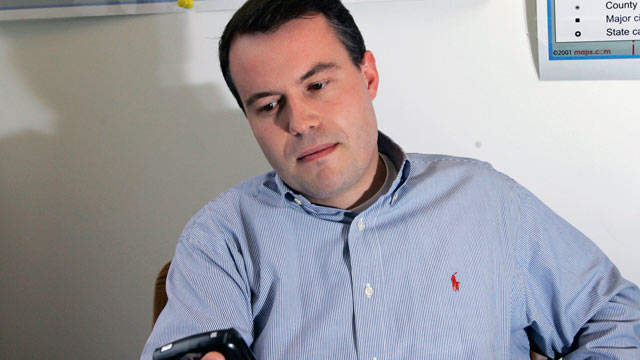 PHOTO: Matt Rhoades, checks his PDA at the Romney 2008 campaign office in Boston in this April 27, 2007 file photo.