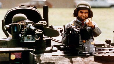 PHOTO: This Sept. 13, 1988 file photo shows Democratic Presidential candidate Michael Dukakis as he gets a free ride in one of General Dynamics' new M1-A-1 battle tanks at its land systems division in Sterling Heights, Mich.