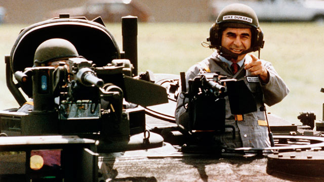 PHOTO: This Sept. 13, 1988 file photo shows Democratic Presidential candidate Michael Dukakis as he gets a free ride in one of General Dynamics' new M1-A-1 battle tanks at its land systems division in Sterling Heights, Mich.