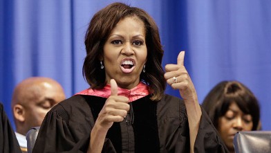 PHOTO: First lady Michelle Obama gives a thumbs up in response to students' cheers after she handed out diplomas to graduates of Martin Luther King, Jr. Academic Magnet High School on Saturday, May 18, 2013, in Nashville, Tenn.