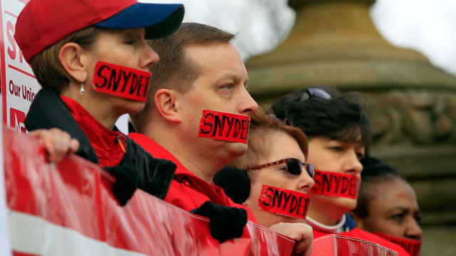 PHOTO: Members of the Michigan Nurses Association stand on the state Capitol steps in Lansing, Mich., Dec. 10, 2012, protesting right-to-work legislation.