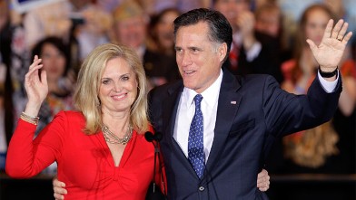 Republican presidential candidate, former Massachusetts Gov. Mitt Romney and his wife Ann wave as they leave at an election night rally in Schaumburg, Ill., after winning the Illinois Primary.