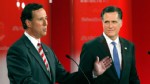 PHOTO: Former Penn. Sen. Rick Santorum gestures as former Mass. Gov. Mitt Romney, right, listens during a Republican presidential debate, Jan. 23, 2012, at the University of South Florida in Tampa, Fla.