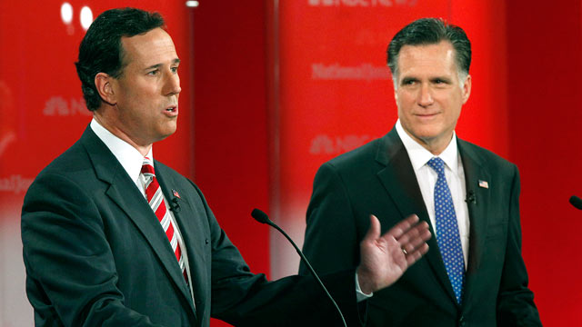 PHOTO: Former Penn. Sen. Rick Santorum gestures as former Mass. Gov. Mitt Romney, right, listens during a Republican presidential debate, Jan. 23, 2012, at the University of South Florida in Tampa, Fla.