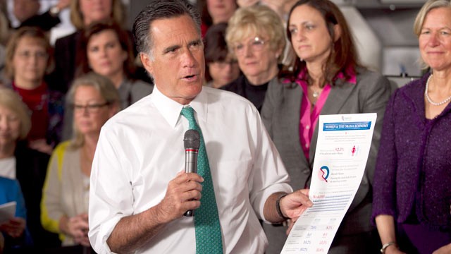 PHOTO: Mitt Romney, holds a flyer on as he speaks in Hartford, Conn., April 11, 2012.