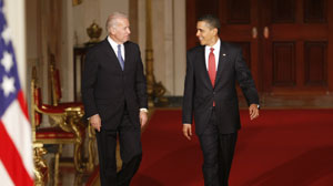 PHOTO President Barack Obama arrives with Vice President Joseph Biden to make a statement to the nation Sunday night following the final vote in the House of Representatives for comprehensive health care legislation, March 21, 2010.