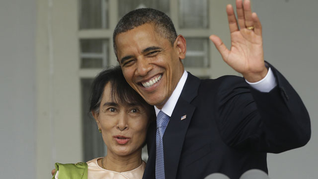 PHOTO: U.S. President Barack Obama, right, waves as he embraces Myanmar democracy activist Aung San Suu Kyi after addressing members of the media at Suu Kyis residence in Yangon, Myanmar, Monday, Nov. 19, 2012.