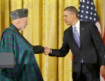 President Barack Obama shakes hands with Afghan President Hamid Karzai at the conclusion of their joint news conference in the East Room of the White House in Washington, Jan. 11, 2013.