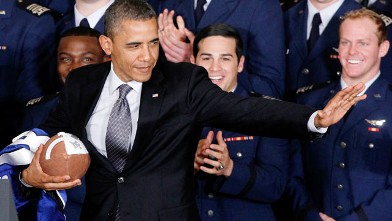 PHOTO: President Barack Obama strikes the Heisman pose after he awarded the Commander-in-Chief Trophy to the Air Force Academy football team, April 23, 2012, in the East Room of the White House in Washington.