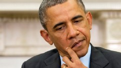 PHOTO: President Barack Obama rubs his face as Myanmar's President Thein Sein speaks during their meeting in the Oval Office of the White House in Washington, May 20, 2013.