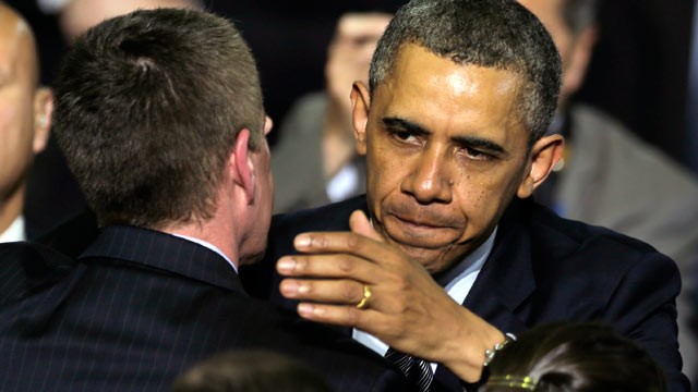 PHOTO: President Obama embraces a man while honoring shooting victims families during a visit to the University of Hartford, in Hartford, Conn., April 8, 2013.