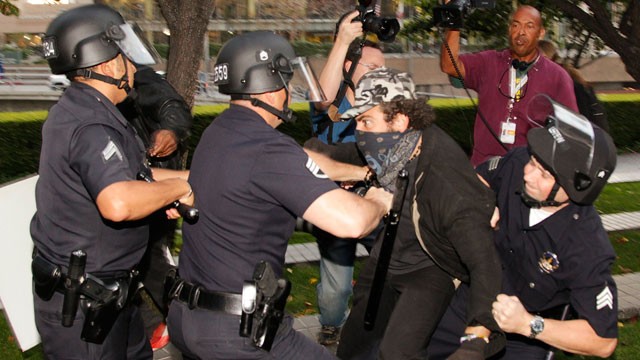PHOTO: Los Angeles police officers struggle to arrest an unidentified police provocateur in Los Angeles on Nov. 17, 2011.