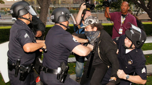 PHOTO: Los Angeles police officers struggle to arrest an unidentified police provocateur in Los Angeles on Nov. 17, 2011.