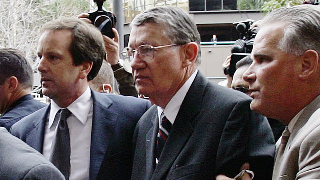 PHOTO: Randall Cunningham, center, is helped by aides as he arrives at the federal courthouse in San Diego for sentencing on his conviction for bribery and tax evasion.