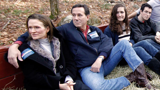 PHOTO: Republican presidential candidate Rick Santorum, second from left, takes a hay ride with his wife Karen, left, his daughter Sarah Maria, his son Daniel, respectively third and forth form left, and other patrons in Candia, N.H., Nov. 26, 2011.