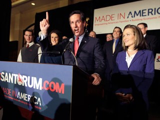 PHOTO: Republican presidential candidate former Pennsylvania Sen. Rick Santorum speaks as his wife Karen, right, listens during a primary night watch party, Feb. 7, 2012, in St. Charles, Mo.
