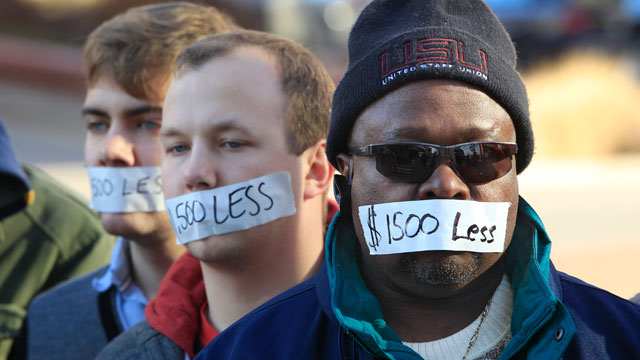 PHOTO: Protesters hold a silent protest in Lansing, Mich., Dec. 12, 2012, a day after thousands of protesters rallied on the grounds as lawmakers pushed final versions of right-to-work legislation.