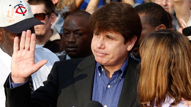 Rod Blagojevich with his wife Patti at his side speaks to the media
