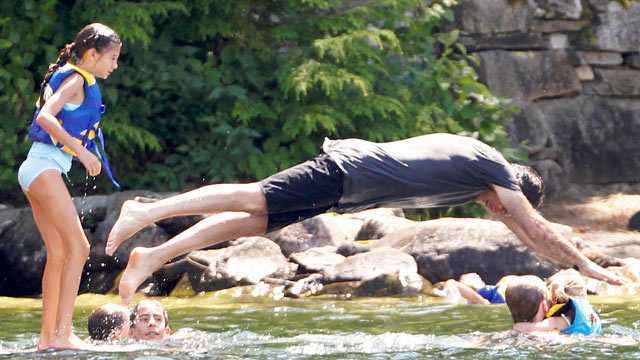 PHOTO: Mitt Romney dives into Lake Winnipesaukee in Wolfeboro, N.H., on July 6, 2012, as he continues his vacation with his family from the campaign trail.