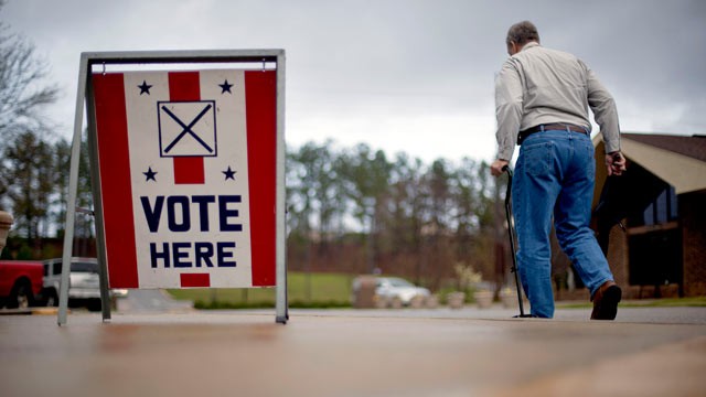 PHOTO: A voter leaves a polling place in Birmingham, Ala. March 13, 2012.