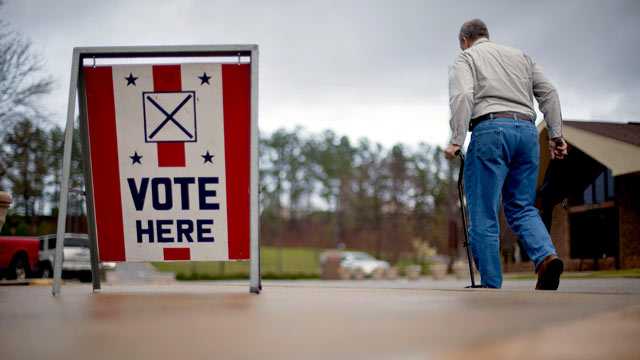 PHOTO: A voter leaves a polling place in Birmingham, Ala. March 13, 2012.