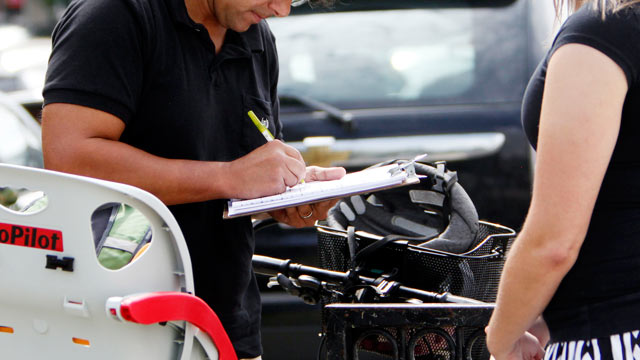 PHOTO: A woman, right, collects a signature during a petition in Columbus, Ohio, in this Sept. 9, 2011 file photo.