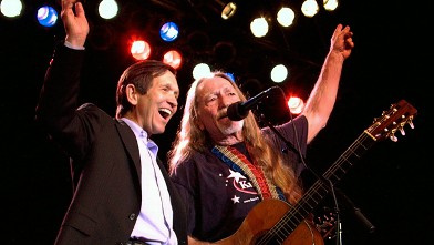 PHOTO: Dennis Kucinich, left, and musician Willie Nelson sing during a campaign fund-raising concert in Austin, Texas, in this Jan. 3, 2004, file photo.
