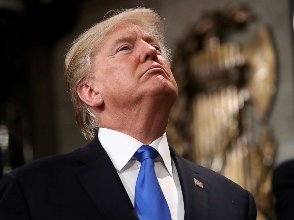 PHOTO: President Donald Trump signs a hat after finishing the State of the Union address in the chamber of the U.S. House of Representatives, Jan. 30, 2018 in Washington, D.C.