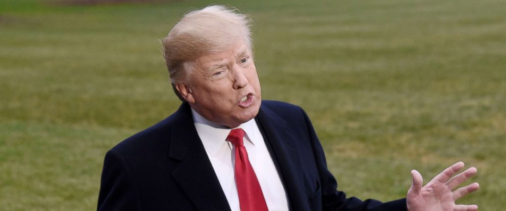 PHOTO: President Donald Trump speaks to the press while walking to Marine One on the South Lawn of the White House, Dec. 15, 2017 in Washington, D.C. 