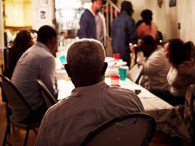 PHOTO: A family eats dinner together.