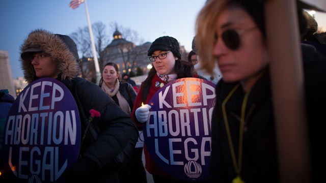 PHOTO: Attendees listen during a candlelight vigil organized by the National Organization for Women in front of the U.S. Supreme Court Jan. 22, 2013 in Washington D.C. The vigil commemorates the 40th anniversary of Roe v. Wade.