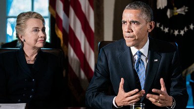 PHOTO: President Barack Obama, right, speaks as U.S. Secretary of State Hillary Clinton listens at a cabinet meeting at the White House, Nov. 28, 2012 in Washington, DC.