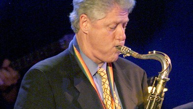 PHOTO: President Bill Clinton plays the sax at 'A Family Celebration 2001' at the Regent Beverly Wilshire Hotel in Beverly Hills, Cali. in this April 1, 2001 file photo.
