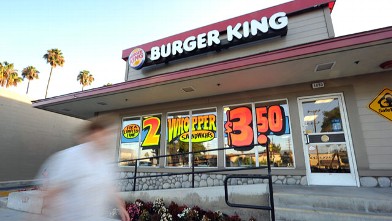 PHOTO: A man walks past a Burger King restaurant in Glendale, California on Sept. 2, 2010.