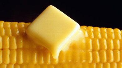 PHOTO: Knob of butter melting over corn on the cob.