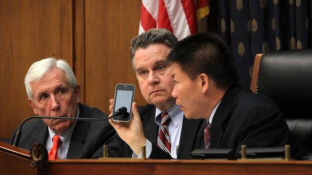 PHOTO: U.S. Rep. Chris Smith (R-NJ), 2nd left, Rep. Frank Wolf (R-VA), left, and Chinese dissident and president of ChinaAid Bob Fu, right, listen to Chinese human rights lawyer Chen Guangcheng on the phone during a hearing before the Congressional-Execut