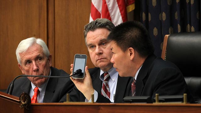 PHOTO: U.S. Rep. Chris Smith (R-NJ), 2nd left, Rep. Frank Wolf (R-VA), left, and Chinese dissident and president of ChinaAid Bob Fu, right, listen to Chinese human rights lawyer Chen Guangcheng on the phone during a hearing before the Congressional-Execut