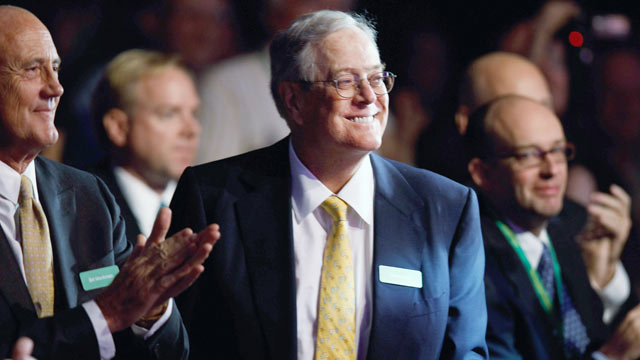 PHOTO: Americans for Prosperity Foundation chairman and Koch Industries Executive Vice President David H. Koch (C) listens to speakers during the Defending the American Dream Summit at the Washington Convention Center, Washington, DC Nov. 4, 2011.