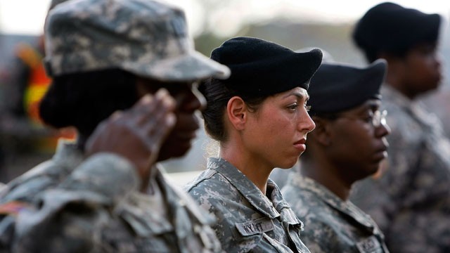 PHOTO: U.S. Army soldiers stand together as they salute during the memorial service that U.S. President Barack Obama and first lady Michelle Obama attended in honor of the thirteen victims of the shooting rampage in this Nov. 10, 2009 file photo in Fort H